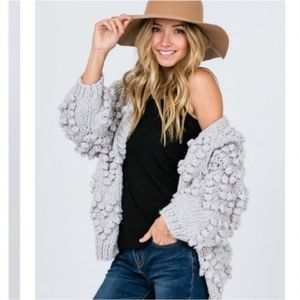 Chunky pom pom cardigan sweater